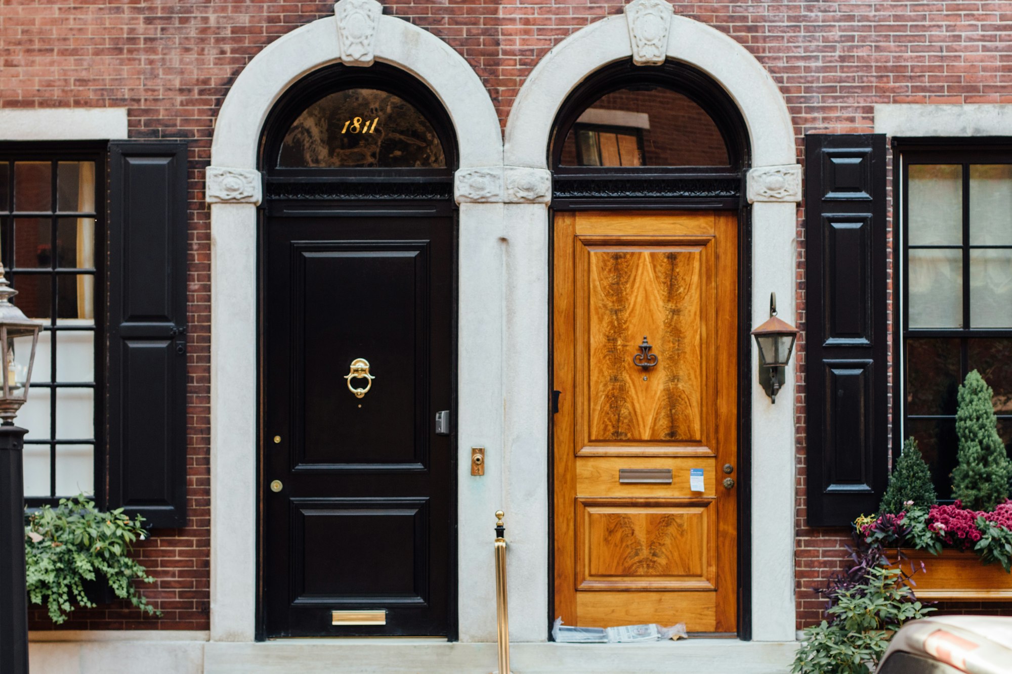 Two solid front entry doors with deadbolts and brass hardware